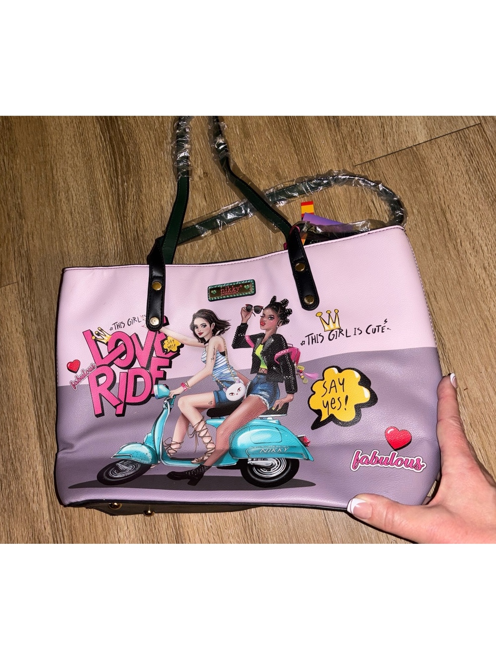 Nikky by Nicole Lee "Love Ride" tote handbag in eco-leather.
Box x